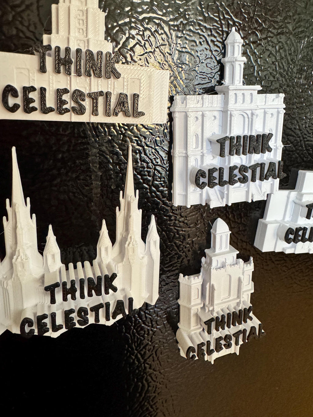 multiple temple magnets on a tin board